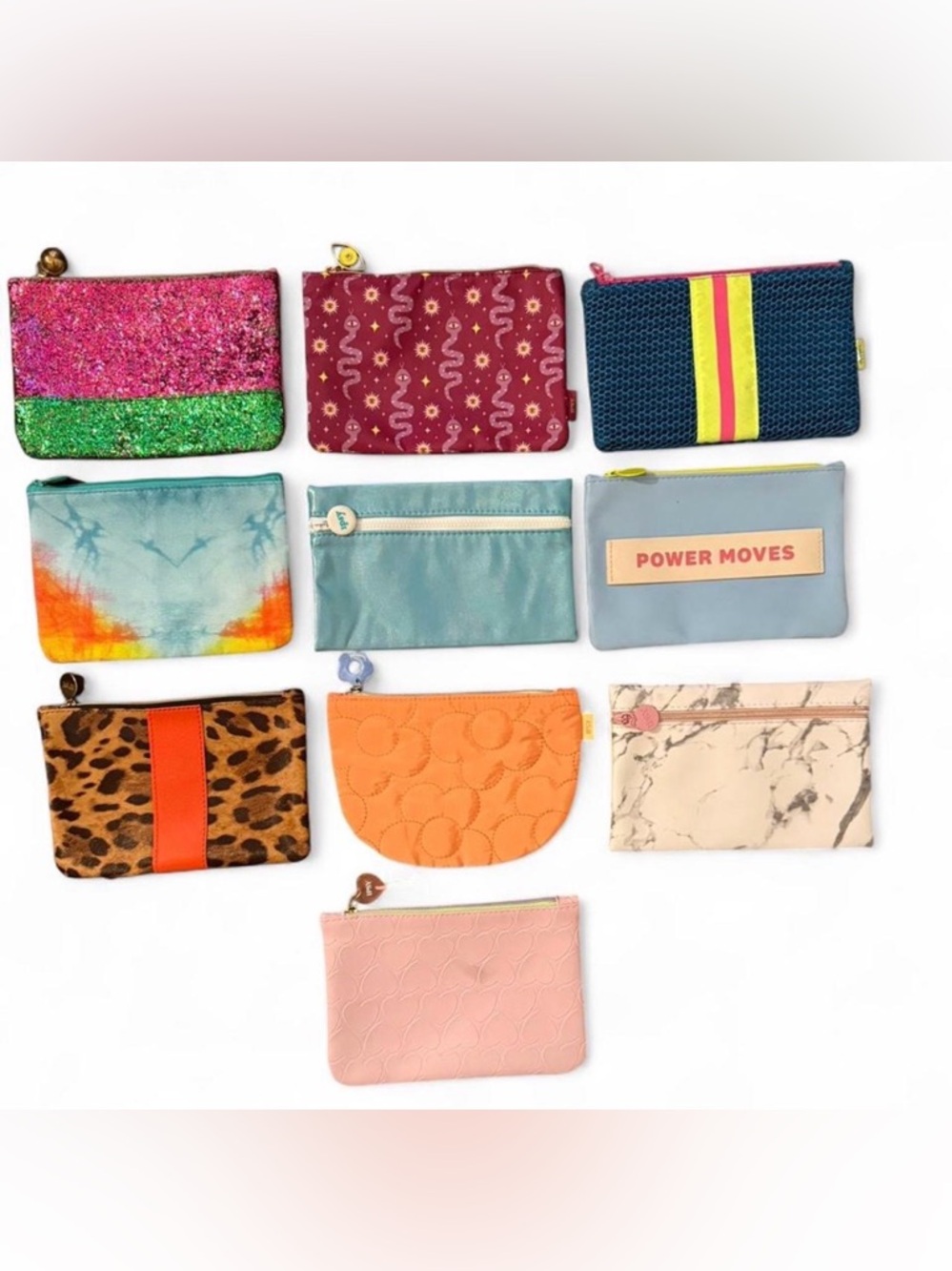 IPSY Set of 10 multi colored makeup/accessories pouches.